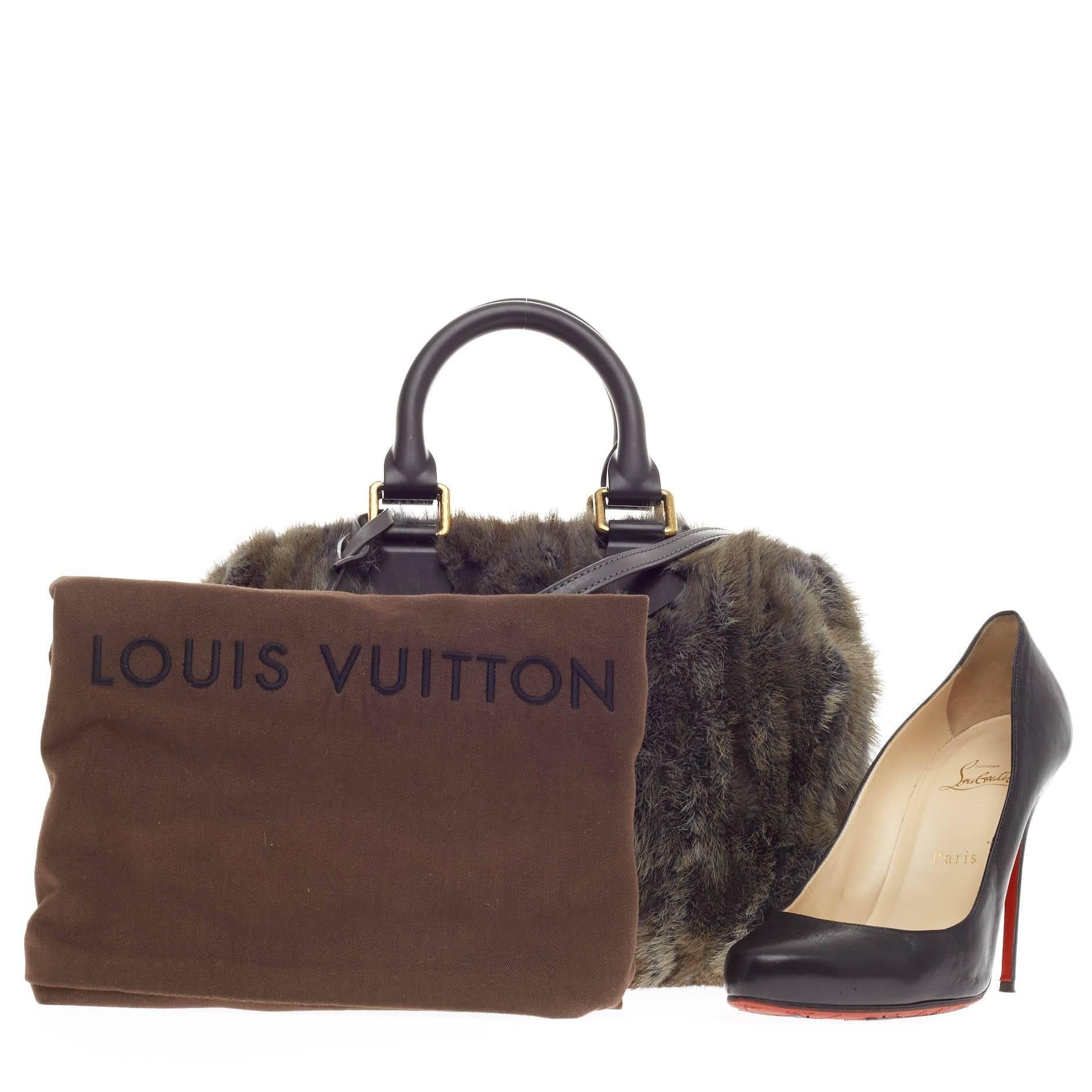 This authentic Louis Vuitton Speedy Limited Edition Caresse Mink 25 is a rare and luxurious piece that is a must-have for any Louis Vuitton lover and collector. Released during the brand's Fall/Winter 2013-2014 Collection, this rare speedy is