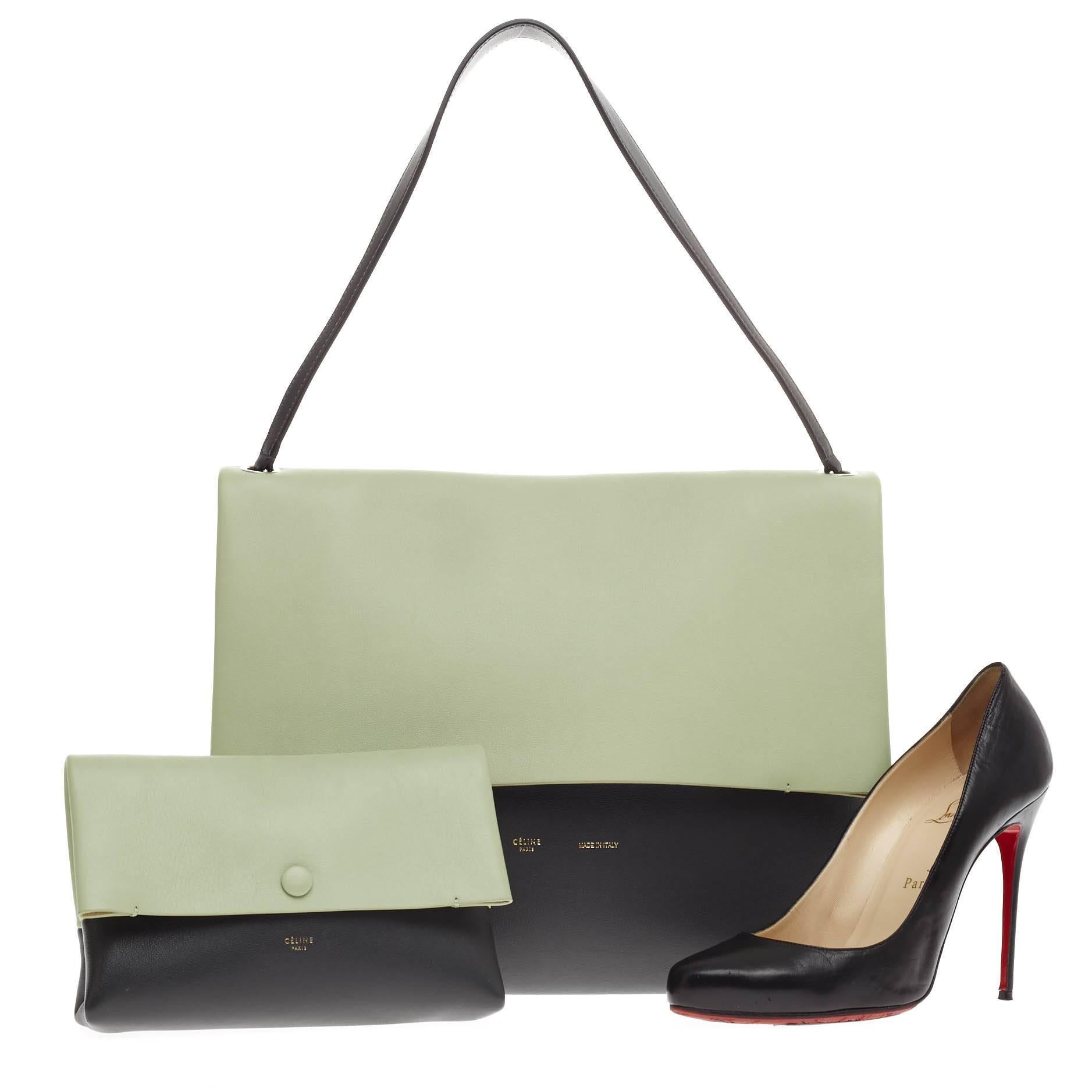 This authentic Celine All Soft Tote Leather in mint green, taupe and black color block hues showcases a neutral and understated look perfect for the modern woman. Crafted from soft calfskin leather, this no-fuss tote features a single handle leather