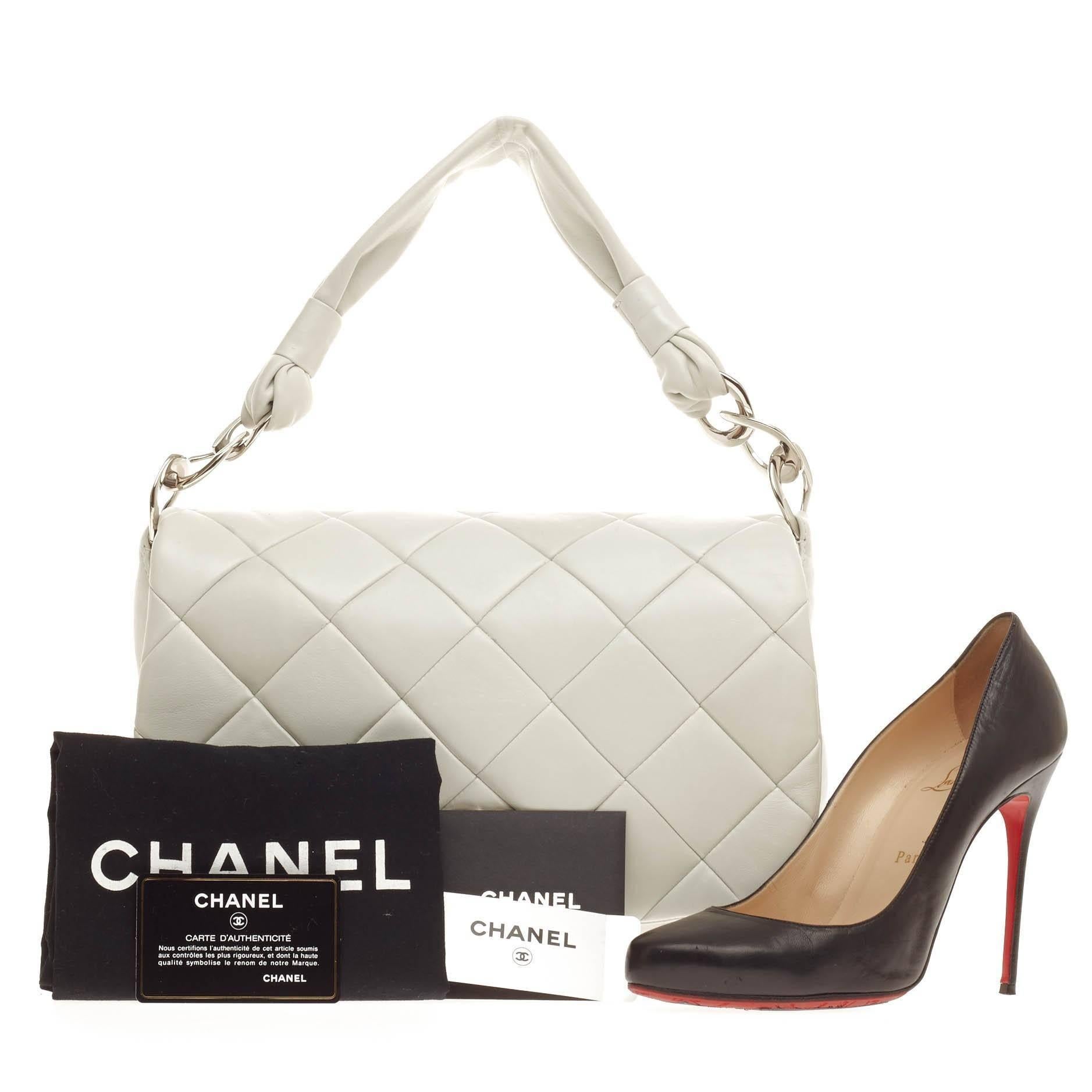 This authentic Chanel Soft Handle Flap Shoulder Bag Quilted Lambskin presented in the brand's Spring/ Summer 2007 Collection is every woman’s favorite. Crafted in white diamond quilted lambskin leather, this full flap shoulder bag features a CC logo