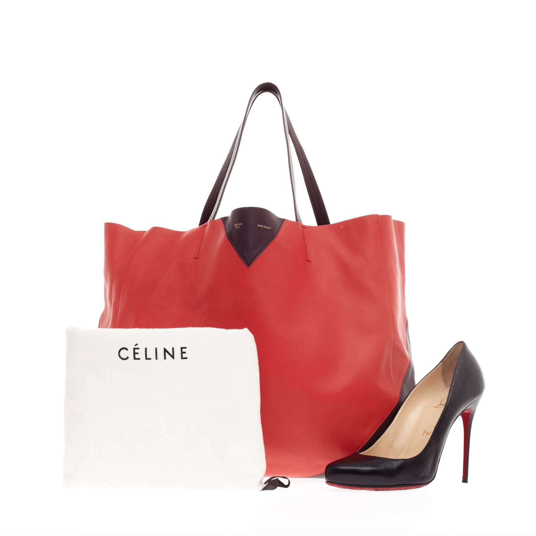 This authentic Celine Horizontal Cabas Tote Leather Large is the perfect oversized travel companion to fit all your essentials and more. Crafted in eye-catching red and brown leather in a minimalist chevron design, this no-fuss tote features dual