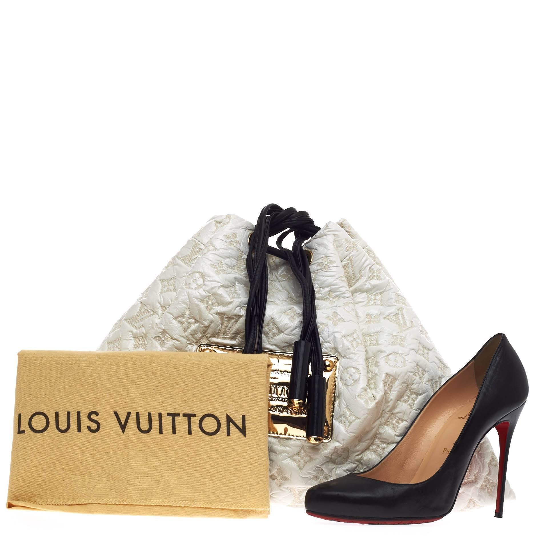 This authentic Louis Vuitton Squishy Tote Monogram Vinyl presented in the brand's Fall/Winter 2006 Inventeur Collection is for the stylish on-the-go woman. Crafted in durable white vinyl and lined canvas with an embossed monogram design, this