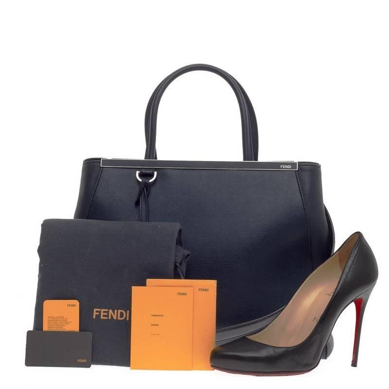 This authentic Fendi 2Jours Leather Medium is impeccably stylish with its rich navy blue hue, simple silhouette and and structured design. Finely crafted in sturdy cross-grain leather with soft calfskin sides, this popular tote features a shining