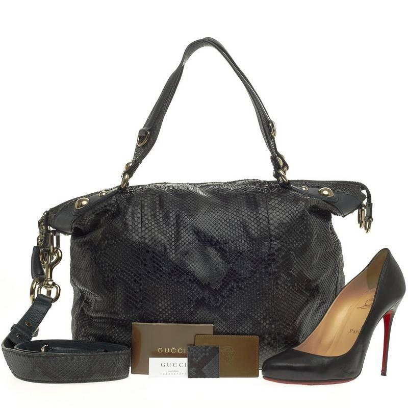 This authentic Gucci Icon Bit Top Handle Bag Python Medium mixes the brand's classic and chic designs with an edgy twist. Crafted in deep green genuine python skin, this exotic-chic satchel features a pleated silhouette, dual-top handles and