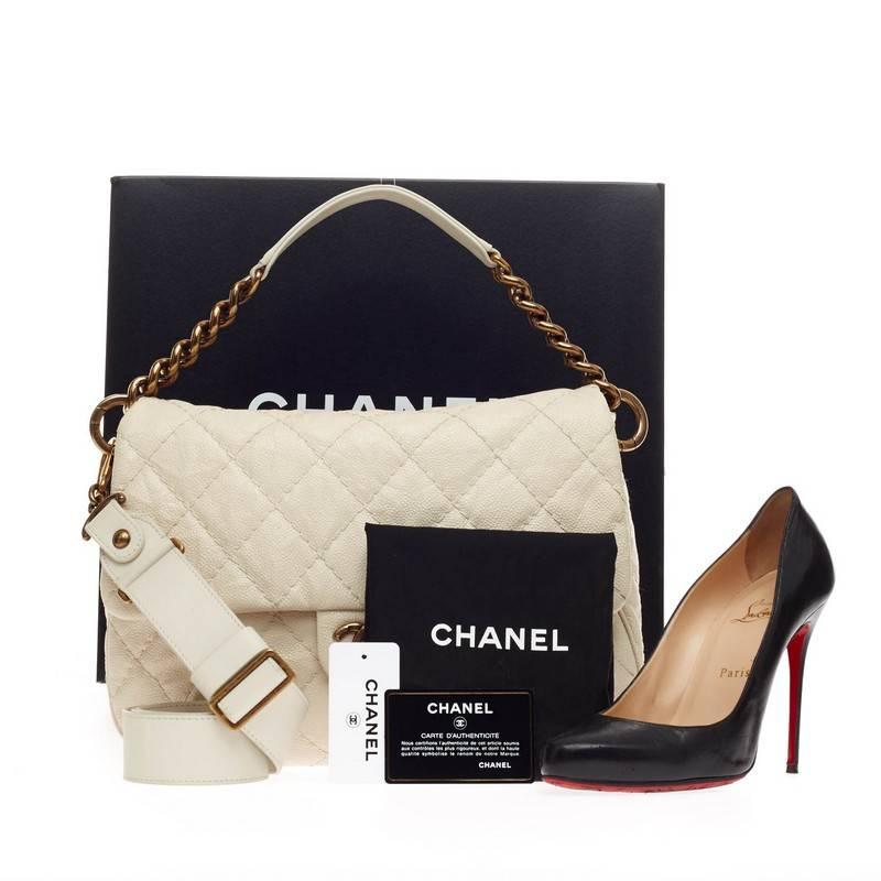 This authentic Chanel Coco Pleats Messenger Quilted Calfskin is designed for modern day fashionistas. Crafted in ivory diamond quilted calfskin leather with detailed pleats, this chic messenger bag features stylized antique-gold tone chain strap and