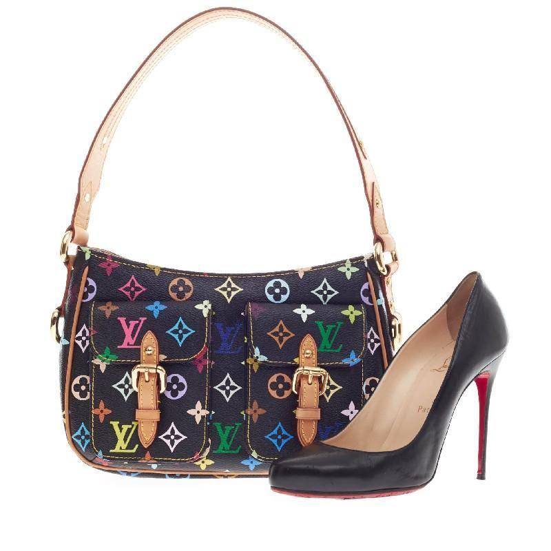 This authentic Louis Vuitton Lodge Monogram Multicolor PM combines style and functionality apt for the modern day woman. Constructed in Louis Vuitton's signature black multicolor canvas print, this classic shoulder bag features a wide vachetta