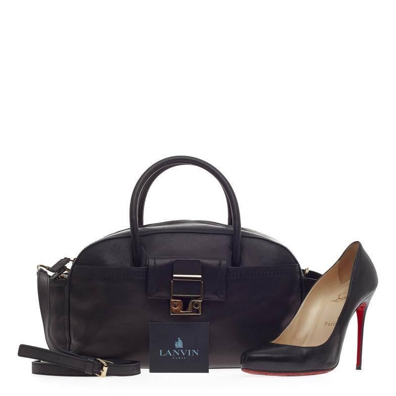 This authentic Lanvin JL Bowling Bag Calfskin Small named after the famed designer Jeanne Lanvin, is classic and sophisticated in design ideal for everyday looks. Crafted in black smooth calfskin leather, this 2011 Collection bowler features