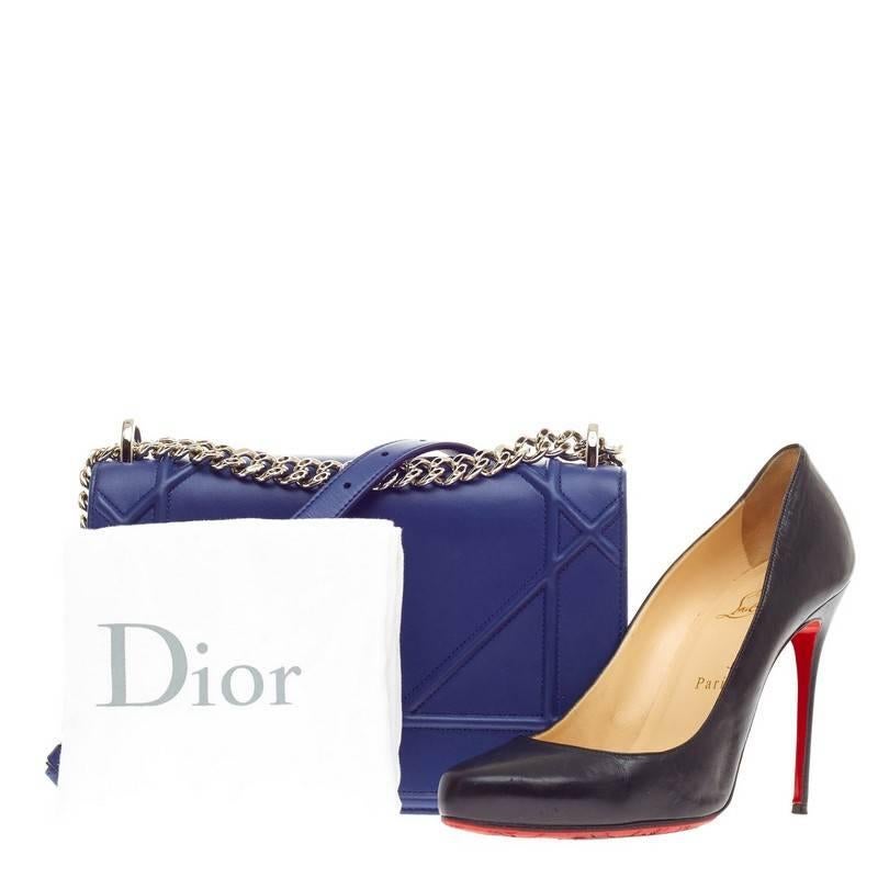 This authentic Christian Dior Diorama Flap Bag Calfskin Medium first seen in the brand's 2015 Collection updates its traditional design with a modern flair. Crafted in royal blue calfskin leather, this architectural flap features an oversized