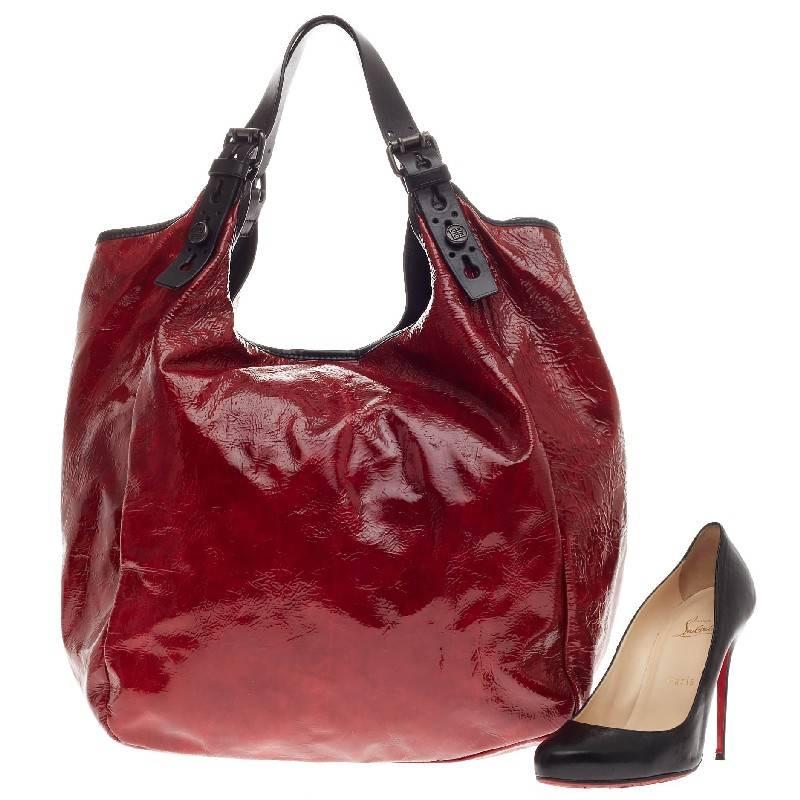 This authentic Givenchy Belt Sacca Shoulder Bag Patent is modern yet casual in design ideal for day to day use. Crafted in striking dark red patent leather, this oversized, edgy tote features dual-flat leather straps with gunmetal Givenchy button