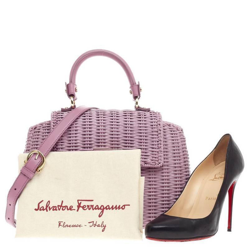 This authentic Salvatore Ferragamo Sofia Satchel Wicker Small presented in the brand's Spring/Summer 2014 Collection in beautiful lilac wicker is stylishly sturdy and functional made for fashionistas. Designed with a glossy finish, this feminine