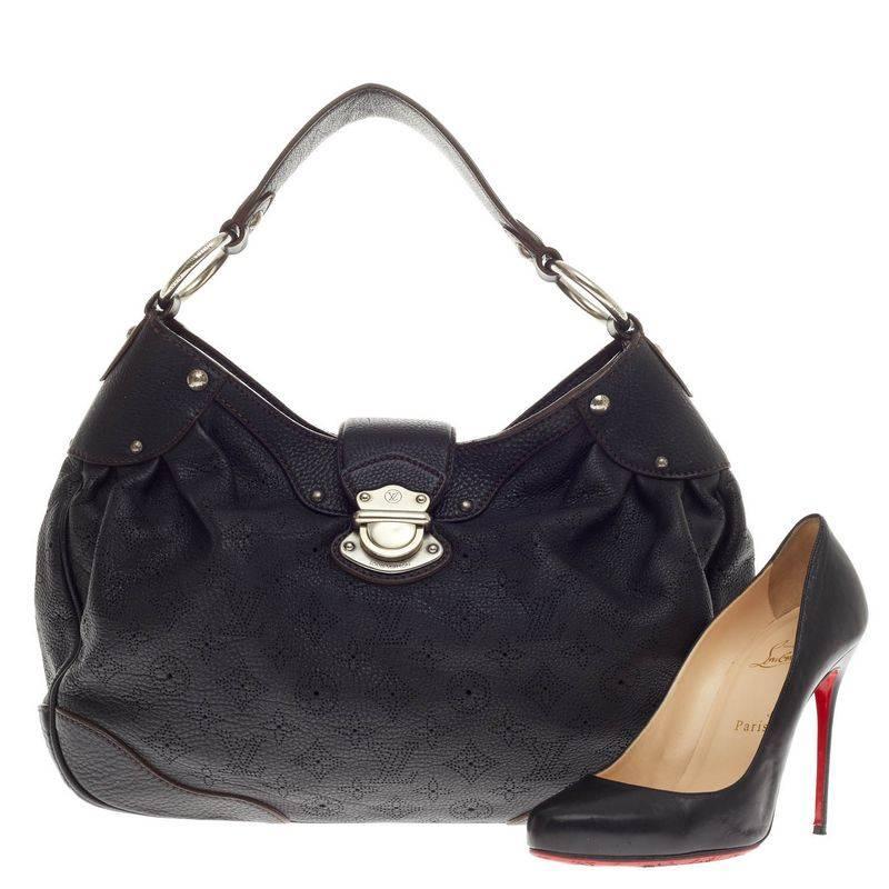 This authentic Louis Vuitton Solar Mahina Leather PM is an easy, feminine design constructed with intricate perforated monogram in noir black mahina leather. Showcased in the brand's Spring/ Summer 2010 Collection, this elegant and roomy hobo
