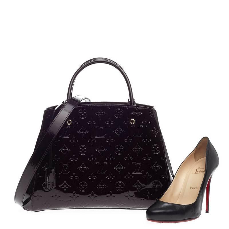 This authentic Louis Vuitton Montaigne Monogram Vernis MM named after the famed Parisian location is as sophisticated as it is sturdy. Crafted from amarante purple monogram vernis, this bag features dual-rolled handles, detachable shoulder strap,
