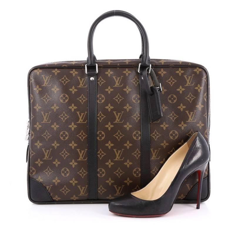 This authentic Louis Vuitton Porte-Documents Voyages Bag Macassar Monogram Canvas PM showcases a traditional men's briefcase silhouette with a luxurious motif. Crafted from the the brand's classic brown monogram coated canvas, this luxurious