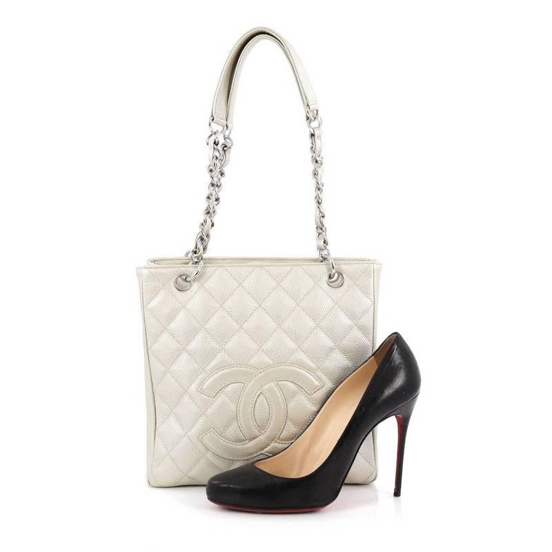 This authentic Chanel Petite Shopping Tote Quilted Caviar is the perfect bag that compliments any outfit for all season. Crafted from metallic diamond quilted caviar leather, this tote features a stitched CC logo, dual woven-in leather chain with
