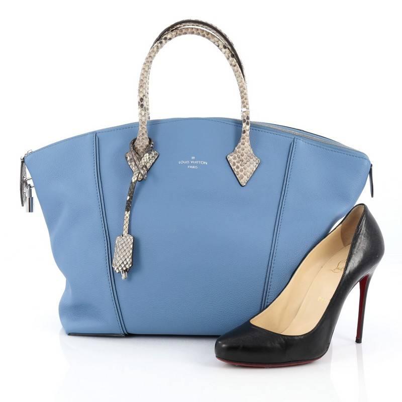 This authentic Louis Vuitton Soft Lockit Handbag Leather with Python MM, is re-imagined with modern and understated, clean lines showcasing the brand's ever-evolving style. Crafted from sky blue leather, this chic tote features dual-rolled genuine