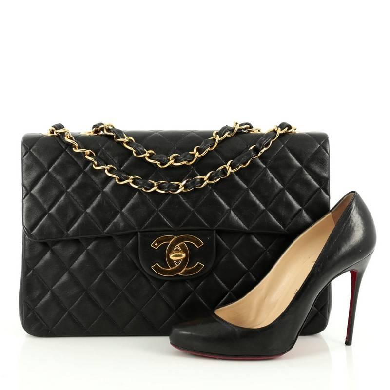 This authentic Chanel Vintage Classic Single Flap Bag Quilted Lambskin Maxi is a timeless essential for any modern woman. Crafted from beautiful black lambskin leather, this coveted classic flap features Chanel's signature diamond quilting design,