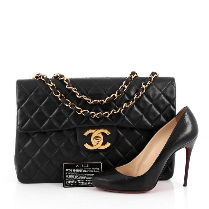 This authentic Chanel Vintage Classic Single Flap Bag Quilted Lambskin Maxi is a timeless essential for any modern woman. Crafted from beautiful black lambskin leather, this coveted classic flap features Chanel's signature diamond quilting design,