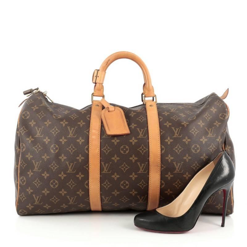 This authentic Louis Vuitton Keepall Bag Monogram Canvas 50 is the perfect purchase for a weekend trip, and can be effortlessly paired with any outfit from casual to formal. Crafted from traditional Louis Vuitton brown monogram coated canvas, this