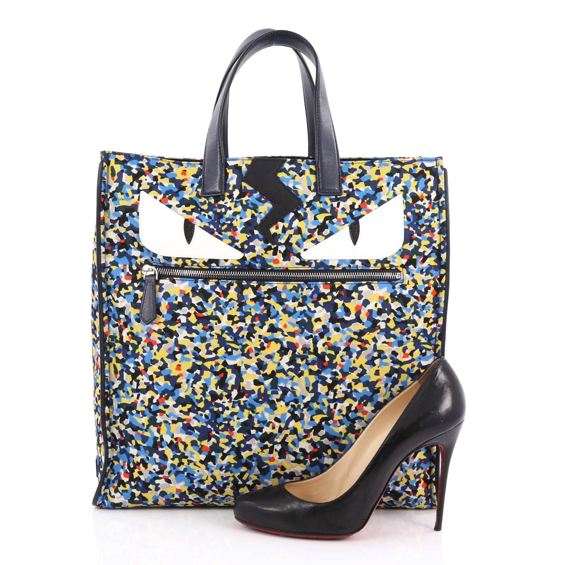 This authentic Fendi Monster Tote Printed Nylon is a stylishly bold, modern tote perfect for any on-the-go moments. Crafted from multicolor nylon with confetti print design, this easy-to-carry tote features dual flat black leather handles,