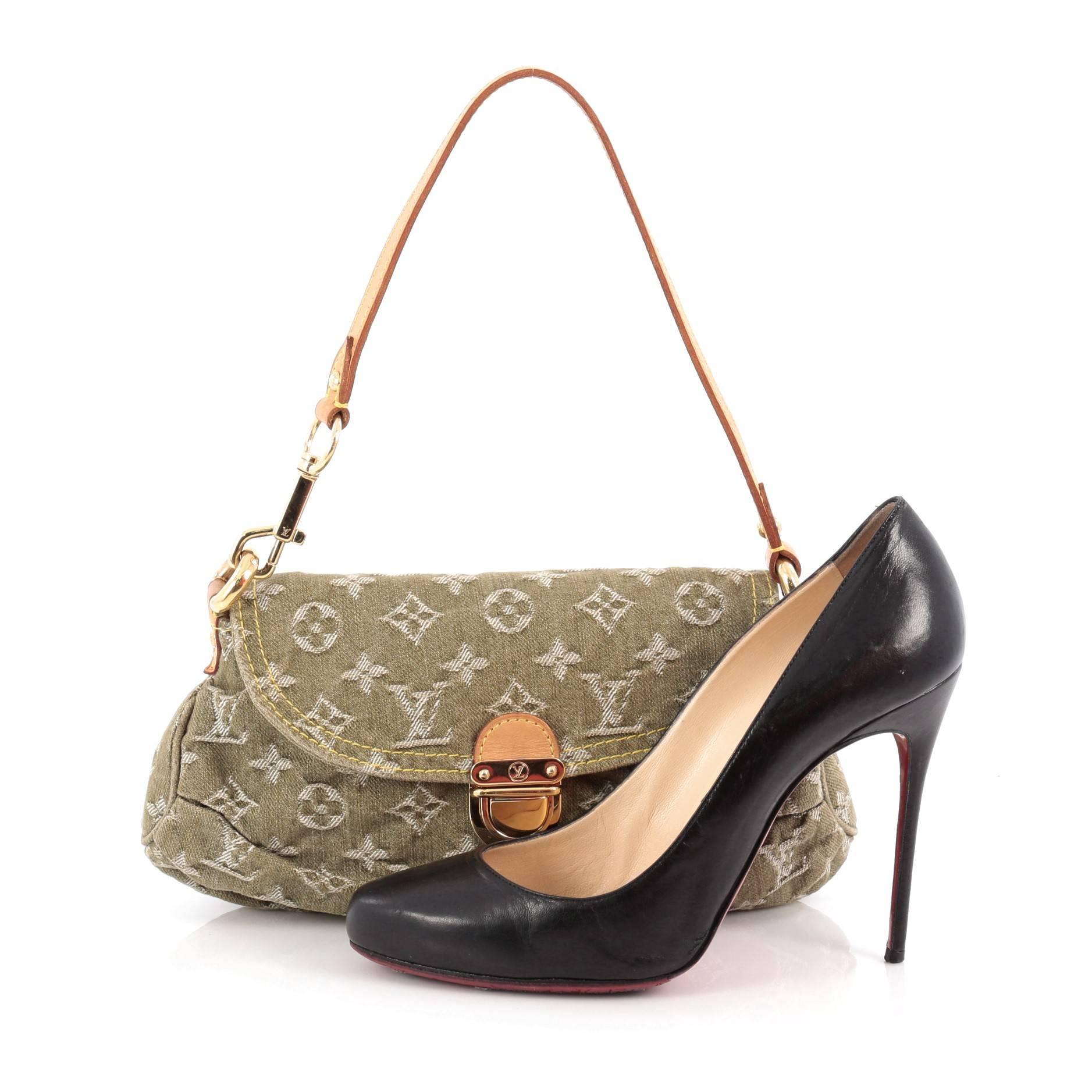 This authentic Louis Vuitton Pleaty Handbag Denim Mini is a fun and flirty bag from the brand's Monogram Denim collection. Crafted from green monogram denim, this mini shoulder bag features an adjustable vachetta leather handle allowing it to