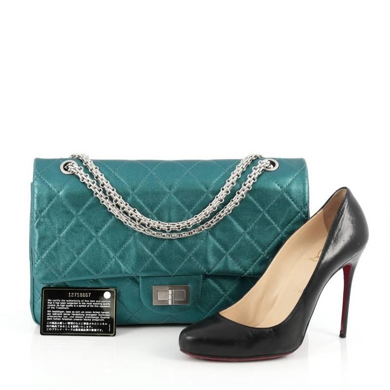 This authentic Chanel Reissue 2.55 Handbag Metallic Quilted Aged Calfskin 227 is an elegant and timeless piece to add to any collection. Crafted from teal blue metallic aged calfskin leather, this stand-out flap features iconic Chanel reissue chain