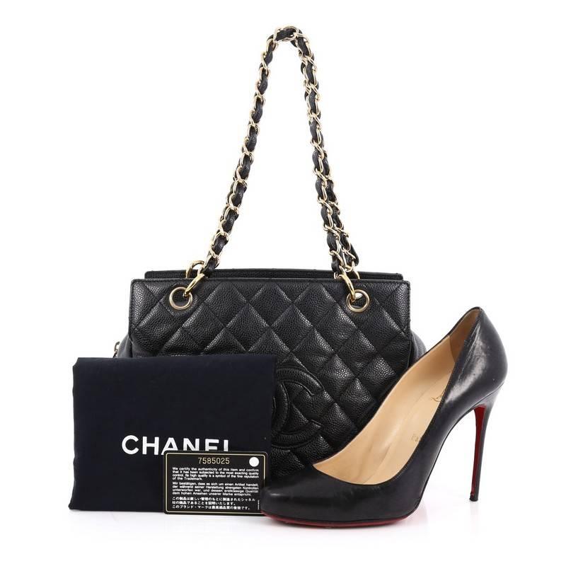 This authentic Chanel Petite Timeless Tote Quilted Caviar is a classic design made for everyday use. Crafted from black caviar leather, this small-sized tote features classic Chanel quilted diamond design, stitched CC logo, woven-in leather chain