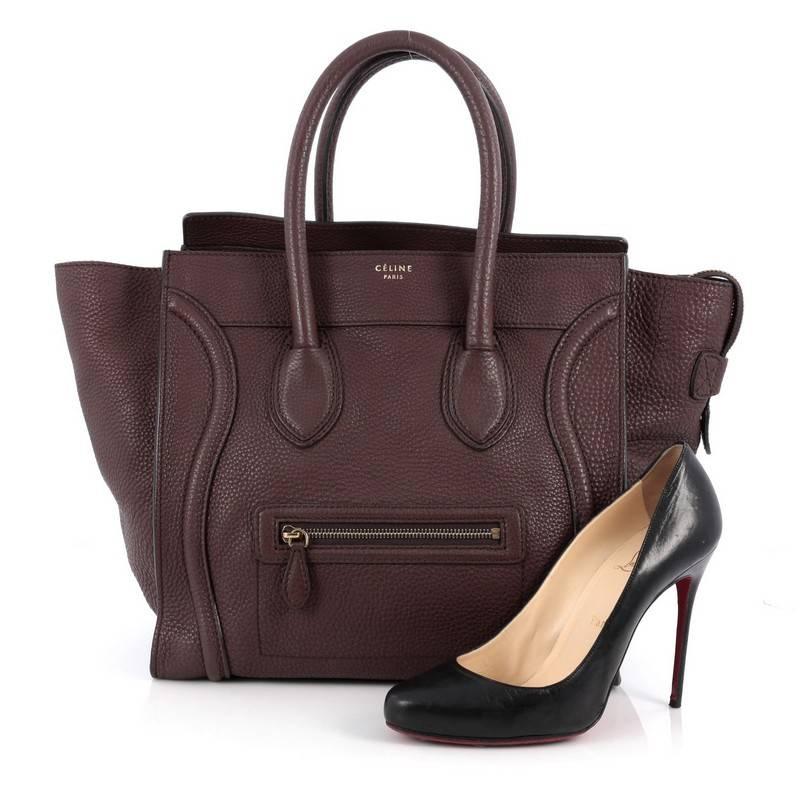This authentic Celine Luggage Handbag Grainy Leather Mini epitomizes Phoebe Philo's minimalist yet chic style. Constructed in brown grainy leather, this beloved fashionista's bag features dual-rolled leather handles, a frontal zip pocket, Celine's