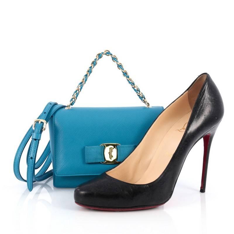This authentic Salvatore Ferragamo Ginny Convertible Shoulder Bag Saffiano Leather Mini mixes a classic design with a luxurious flair. Crafted from blue saffiano leather, this petite bag features the stylish Vara-shoe pleated bow design classic to