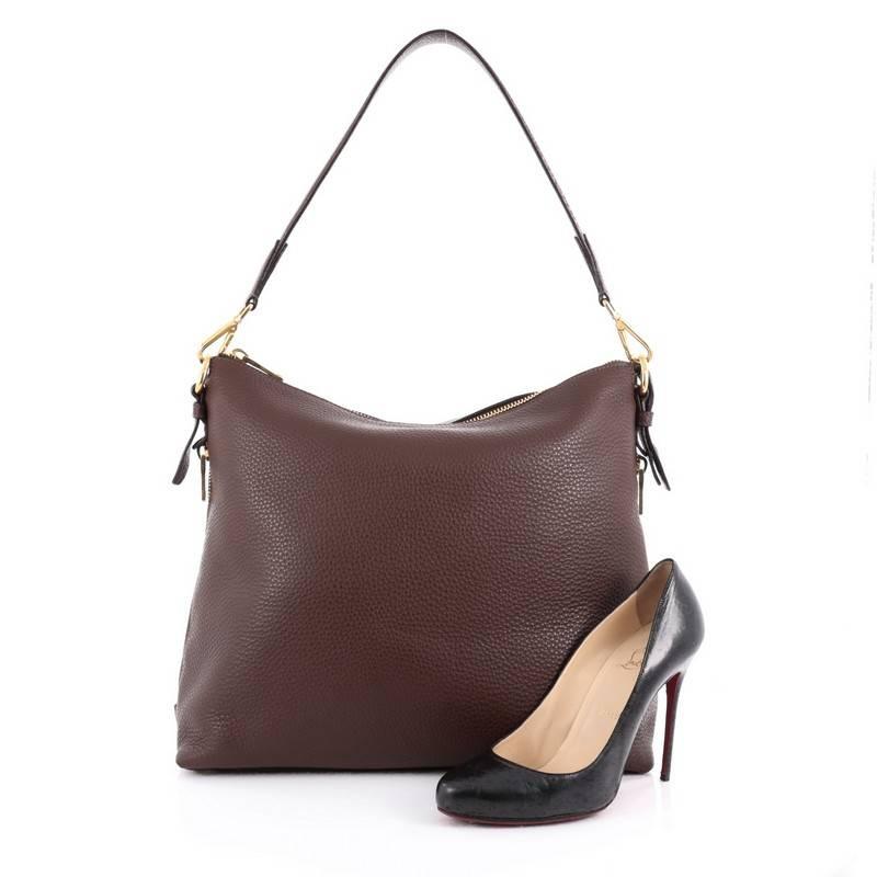 This authentic Prada Side Zip Hobo Vitello Daino Large is a classic design perfect for everyday use. Crafted in brown vitello daino leather, this hobo features single loop detachable leather strap, Prada inverted triangle logo, side gusset zippers,