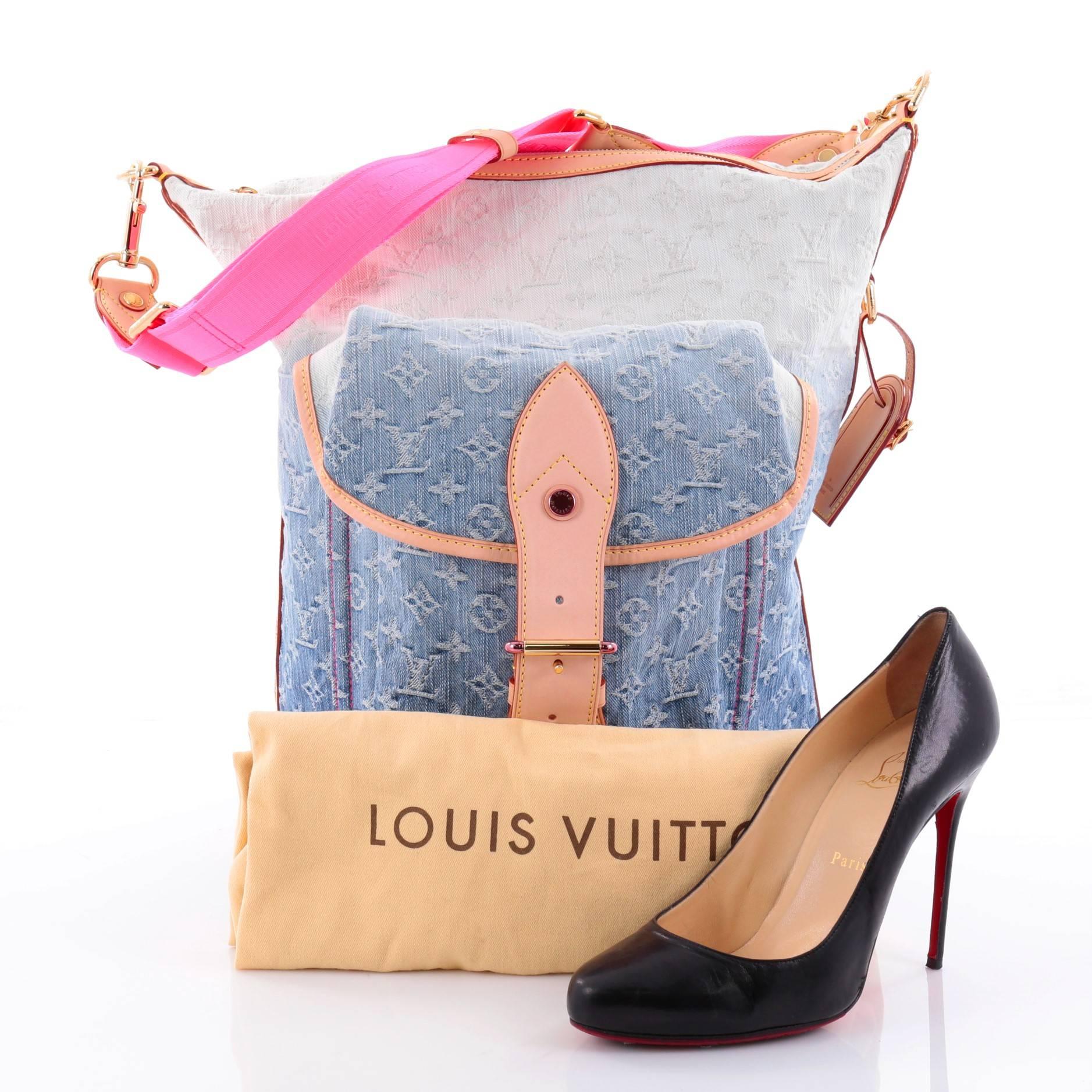 This authentic Louis Vuitton Sunburst Handbag Denim PM from the brand's 2010 Spring/Summer collection will surely add a beautiful splash of color to any ensemble. Crafted in gradient blue monogram denim, this stylish bag features a flat nylon