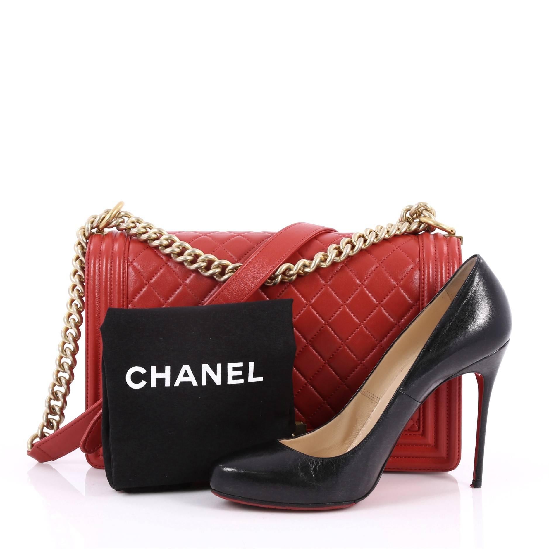 This authentic Chanel Boy Flap Bag Quilted Lambskin New Medium is every woman's dream. Crafted from red diamond quilted lambskin leather, this enviable Boy flap bag features a chunky chain link strap with shoulder pad, CC Boy logo push-lock closure,