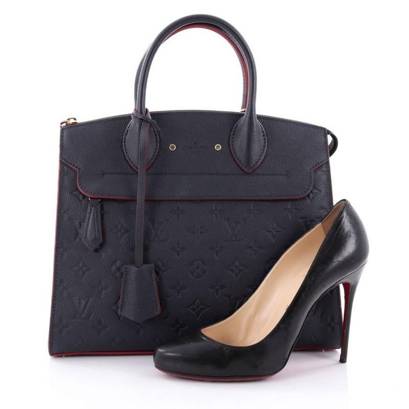 This authentic Louis Vuitton Pont Neuf Handbag Monogram Empreinte Leather MM is a classic must-have structured handle bag. Constructed in sturdy, navy blue monogram empreinte leather, this simple, functional bag showcases dual rolled leather
