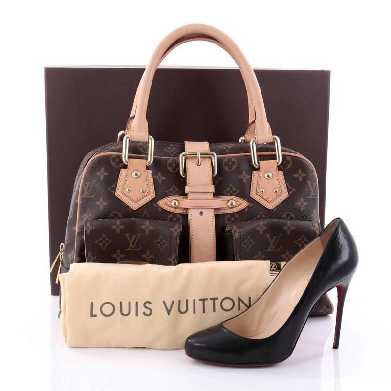 This authentic Louis Vuitton Manhattan Handbag Monogram Canvas GM combines style and functionality apt for the modern day woman. Constructed in Louis Vuitton's signature monogram coated canvas, this classic satchel features dual-rolled vachetta