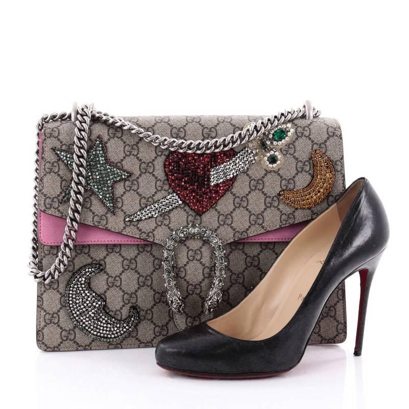 This authentic Gucci Dionysus Handbag Sequin Embellished GG Coated Canvas Medium named after the Greek God is a stunning piece created by famed designer Alessandro Michele in his Spring/Summer 2016 Collection. Crafted from taupe GG coated canvas