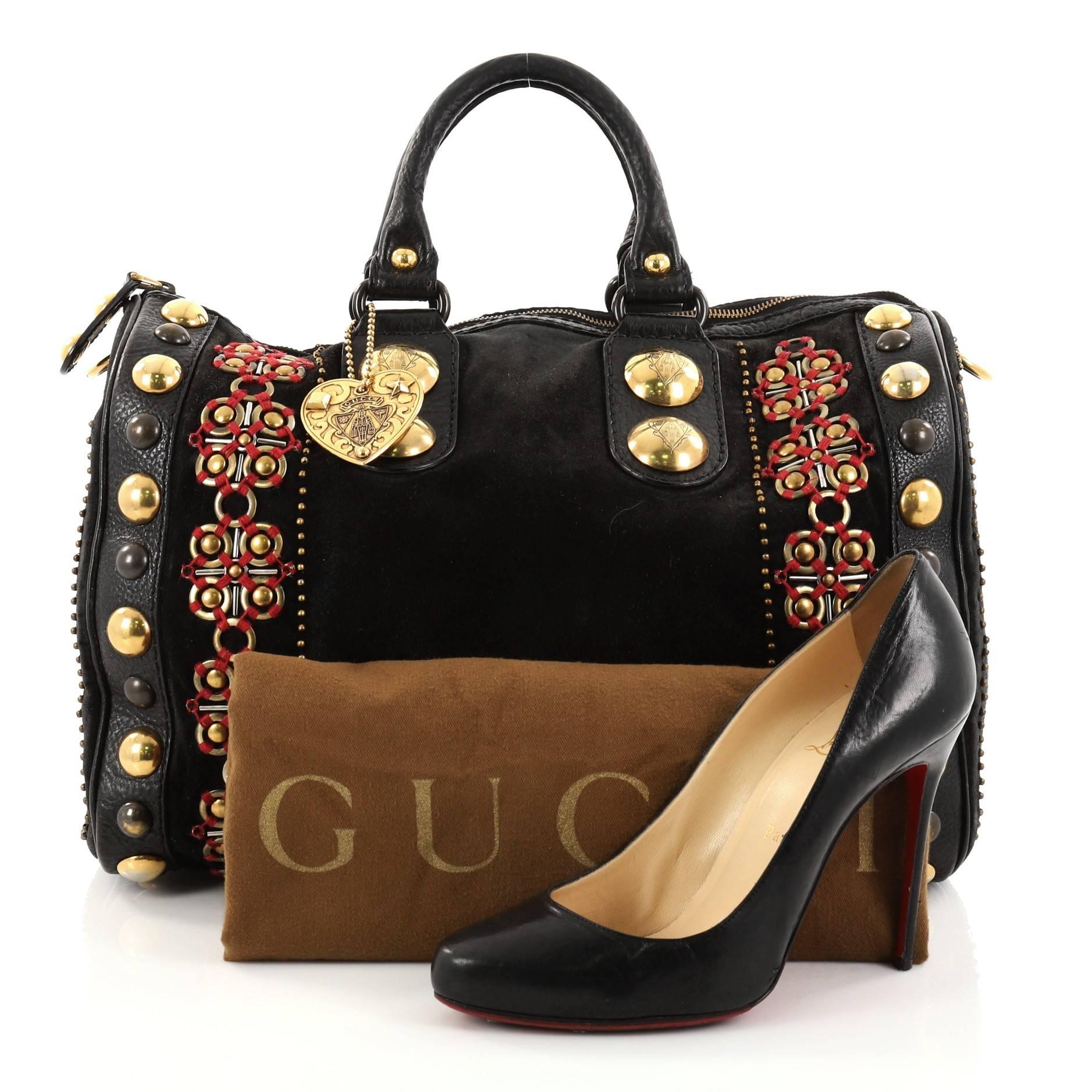 This authentic Gucci Babouska Boston Bag Embellished Suede Large is luxurious in design perfect for everyday use. Crafted in black suede, this luxuriously adorned boston bag features dual-rolled handles, gold Gucci heart medallion, all-around