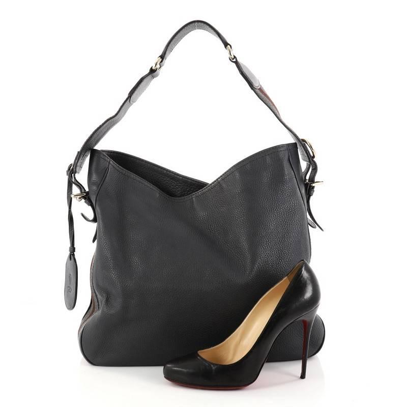 This authentic Gucci Heritage Web Hobo Leather Medium is ideal for everyday travel. Crafted from dark gray leather, this hobo features flat adjustable leather strap with buckle accents, signature Gucci Web detailing along bottom and sides, and