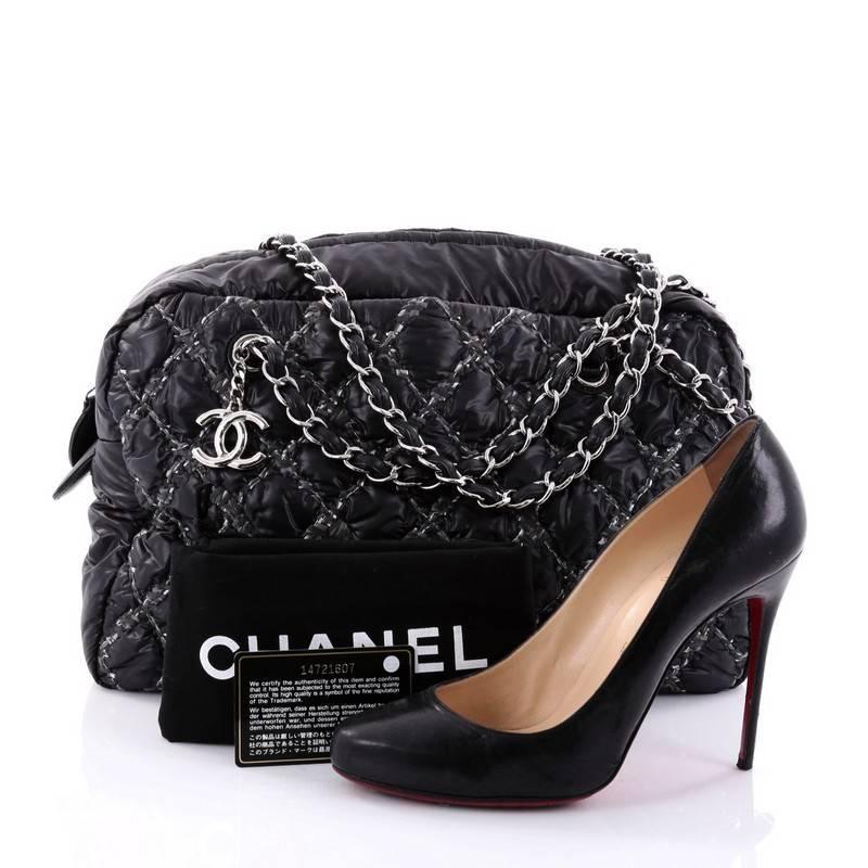 This authentic Chanel Tweed On Stitch Camera Case Bag Quilted Nylon Medium is a stylish and unique bag. Crafted in 