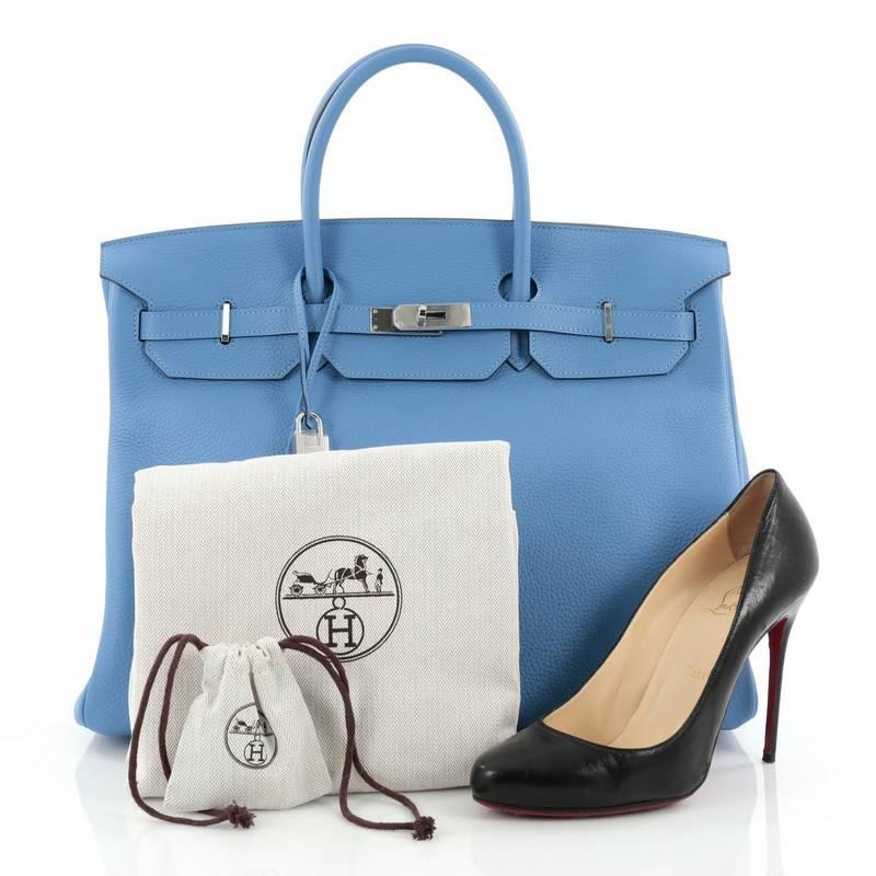 This authentic Hermes Birkin Handbag Blue Paradis Clemence with Palladium Hardware 40 is synonymous to traditional Hermes luxury. Crafted with sturdy, scratch-resistant blue hydra clemence leather, this eye-catching luxurious tote is accented with