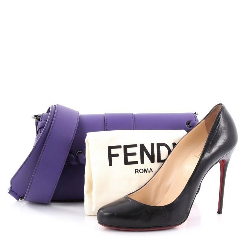 This authentic Fendi Baguette Whipstitch Leather is a show-stopping must-have accessory for the boldest of fashionistas. Crafted from purple leather, this fun and trendy bag features removable guitar strap, leather whipstitch trims, front flap with