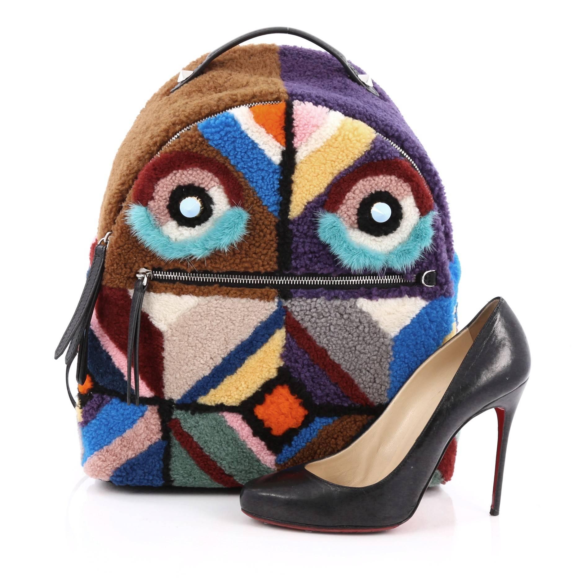 This authentic Fendi Bugs Backpack Multicolor Shearling with Fur is an eye catching, luxurious, playful style made for on-the-go fashionistas. Crafted from genuine multicolored dyed mink fur and dyed lamb shearling fur, this unique bag features,