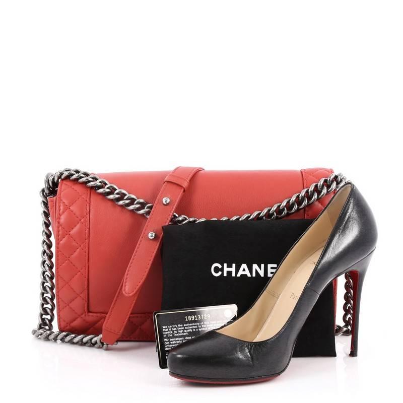 This authentic Chanel Reverso Boy Flap Bag Calfskin New Medium is every woman’s dream. Crafted in red calfskin leather with quilted stitched on edges, this popular bag features aged silver chain link straps with leather pads, iconic CC logo with boy