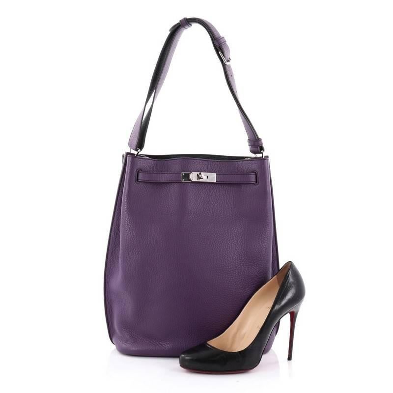 This authentic Hermes Eclat So Kelly Handbag Clemence 26 is an updated and modern reinterpretation of the Kelly Sport, taking its distinct look to Hermes' classic Kelly design. Crafted in ultraviolet clemence leather, this luxurious hobo features