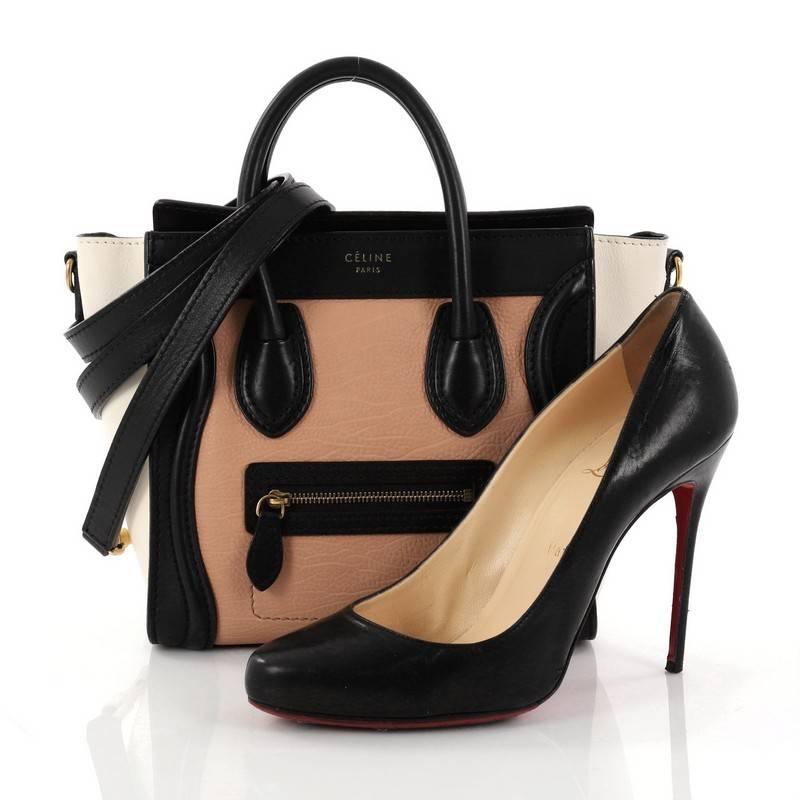 Cet authentique sac à main en cuir Nano Tricolor Luggage Handbag de Celine présente un style élégant indispensable à toute fashionista. Réalisé en cuir pêche et noir avec des ailes en cuir écru, ce fourre-tout populaire est doté d'une poche frontale