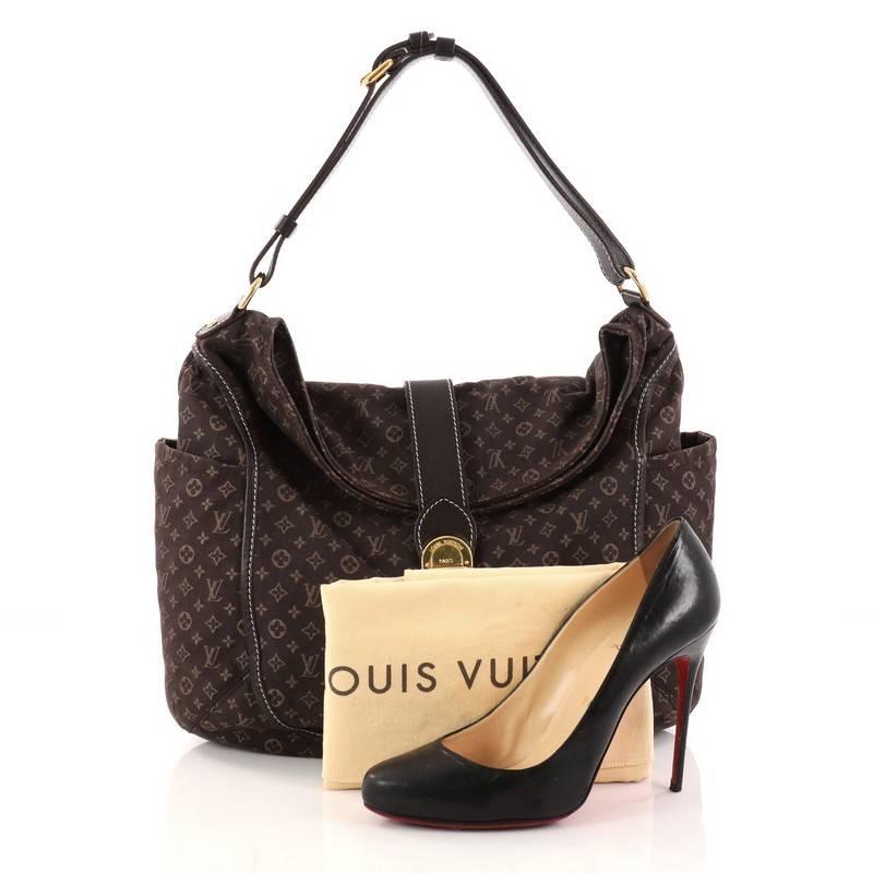 This authentic Louis Vuitton Romance Handbag Monogram Idylle is a statement piece you can surely take from day to night. Crafted with Louis Vuitton's signature dark brown monogram idylle canvas, this bag features side slip pockets, an adjustable