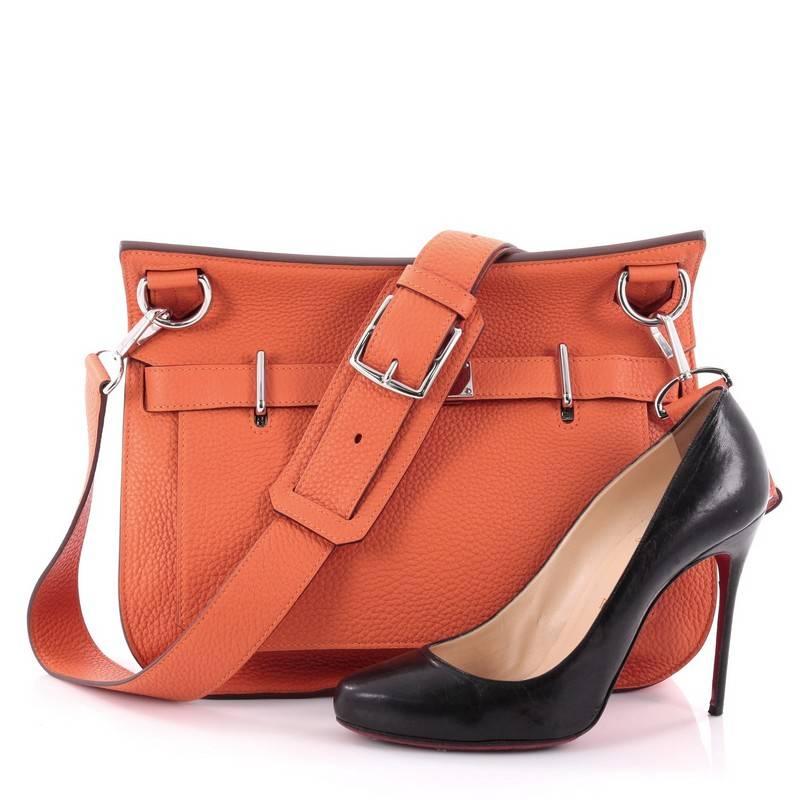 This authentic Hermes Jypsiere Handbag Clemence 31, inspired by the iconic Kelly bag, is a current and favourite style among Hermes lovers. Crafted from feu orange leather, this luxurious messenger features flat adjustable leather shoulder strap and