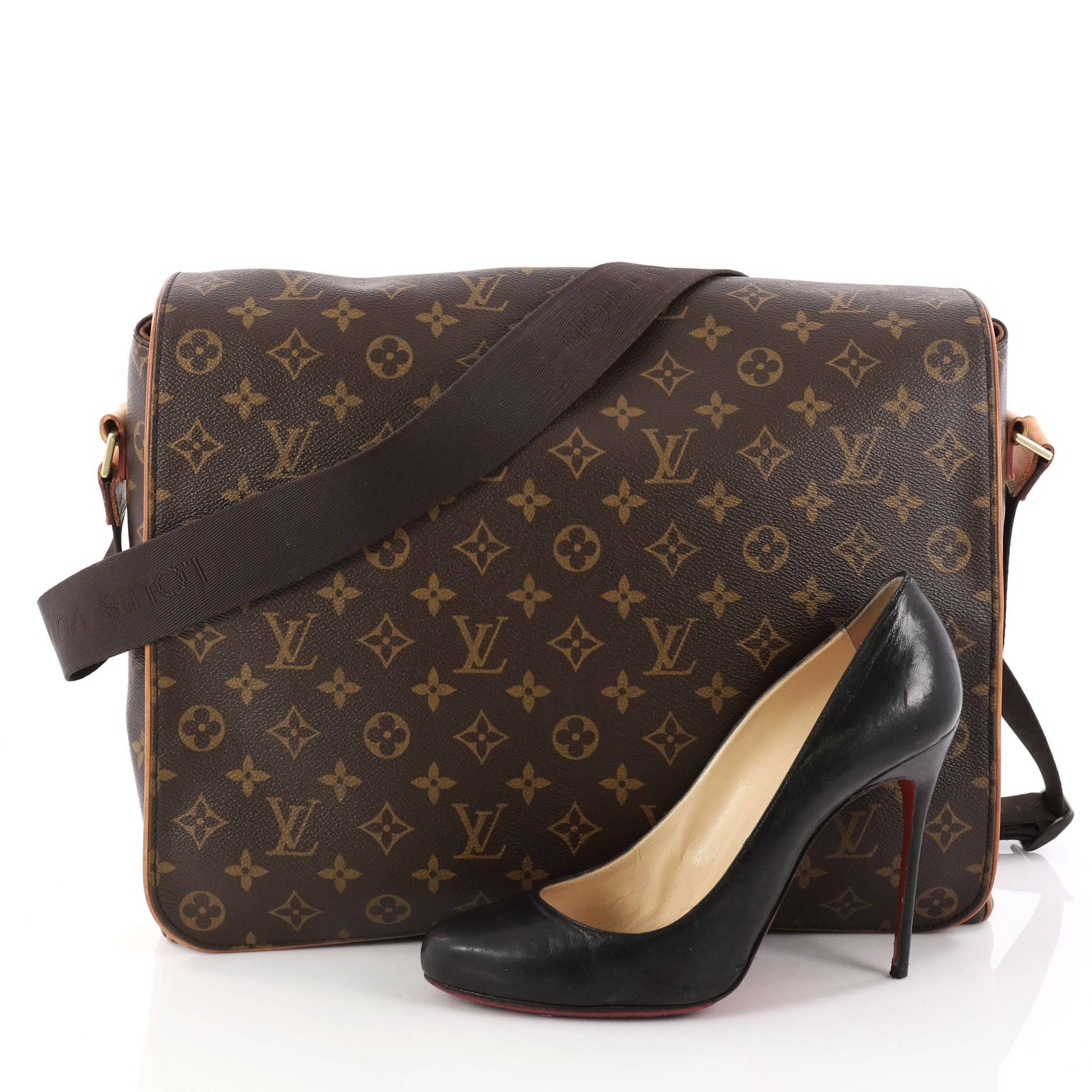 This authentic Louis Vuitton Abbesses Bag Monogram Canvas mixes Louis Vuitton's classic style with luxurious functionality. Crafted from the brand's iconic brown monogram coated canvas, this oversized messenger bag features vachetta leather piping,
