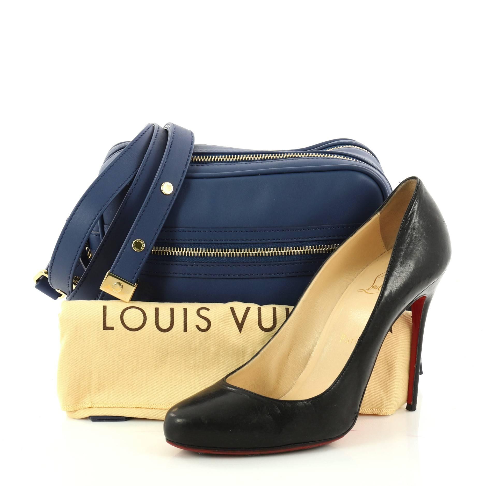 This authentic Louis Vuitton Flight Paname Takeoff Bag Leather Small is a limited edition bag perfect for your everyday excursions. Crafted in blue leather, this bag features flat adjustable shoulder strap, exterior front zip pocket and back slip