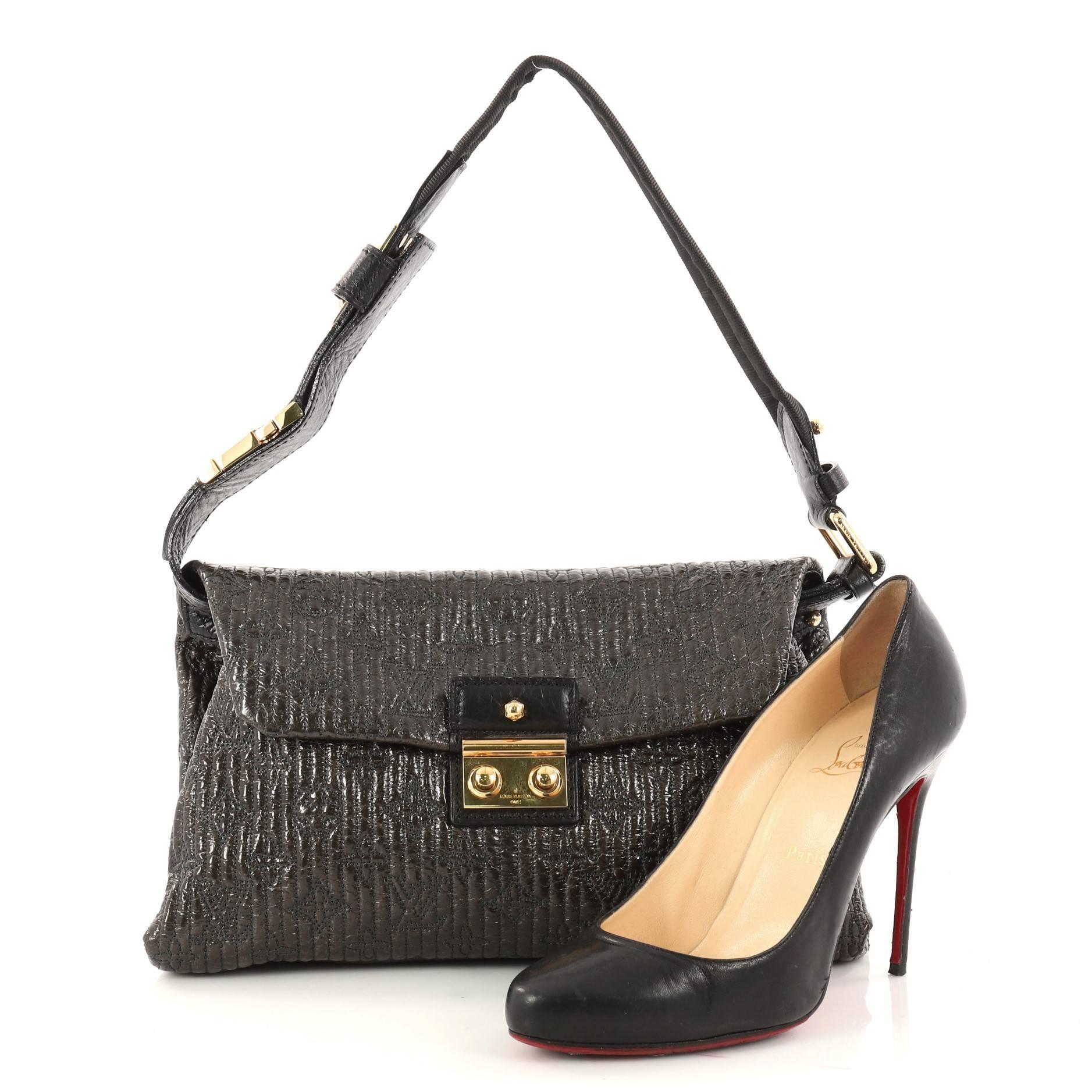 This authentic Louis Vuitton Motard Pochette Monogram Quilted Leather is a luxurious and stylish bag perfect for your day or night out. Crafted in brown monogram quilted leather, this stunning bag features a detachable strap, gold-press-lock closure