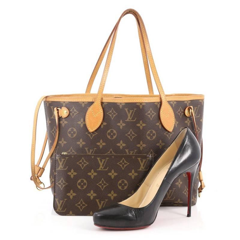 This authentic Louis Vuitton Neverfull NM Tote Monogram Canvas PM is a perfect companion for daily excursions. Crafted from Louis Vuitton's signature brown monogram canvas, this iconic easy-to-carry bag features natural dual flat leather straps,