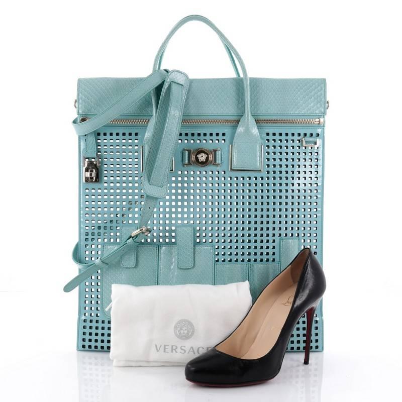This authentic Versace Front Pocket Convertible Tote Perforated Patent and Snakeskin Large is a stylish and versatile accessory that will put an end to digging through a messy bag. Crafted from turquoise perforated patent leather with snakeskin