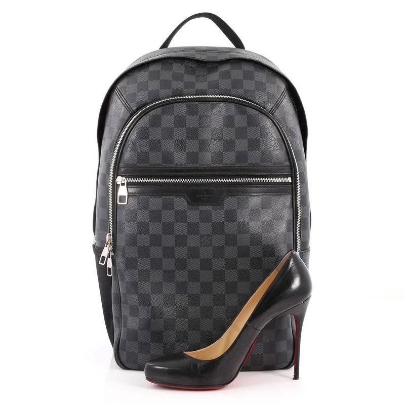 This authentic Louis Vuitton Michael Backpack Damier Graphite is a luxe backpack combining style and comfort. Crafted from damier graphite coated canvas, this chic backpack features a short flat leather handle, two canvas padded backpack straps,